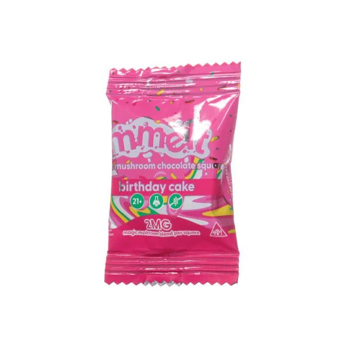Pink package of 'mhell' birthday cake flavored chocolate squiggle on a white background.